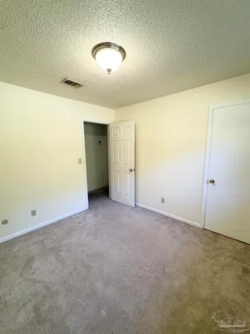 an empty room with a empty space and window