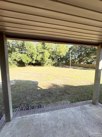 a view of a swimming pool and an outdoor seating