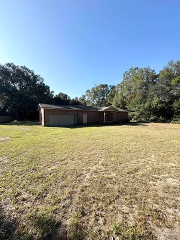 a view of house with outdoor space