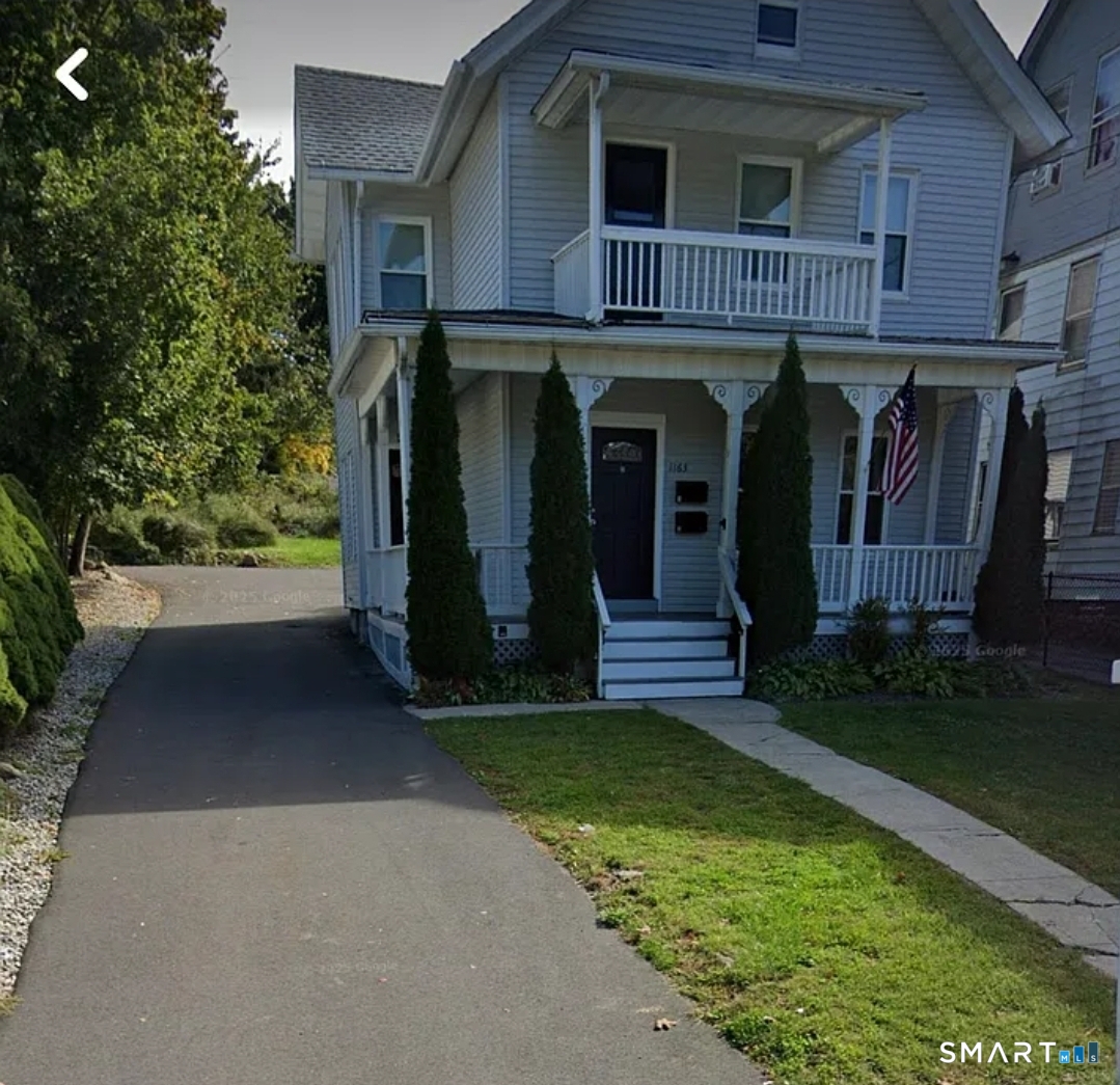 1163 West Main Street Waterbury, CT 06708 - Photo 11 of 11 a view of a house with potted plants and a yard
