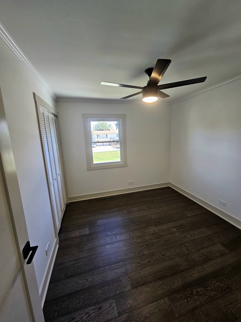 6230 Boca Rio Drive Oak Forest, IL 60452 - Photo 20 of 29 a view of an empty room with wooden floor and a window