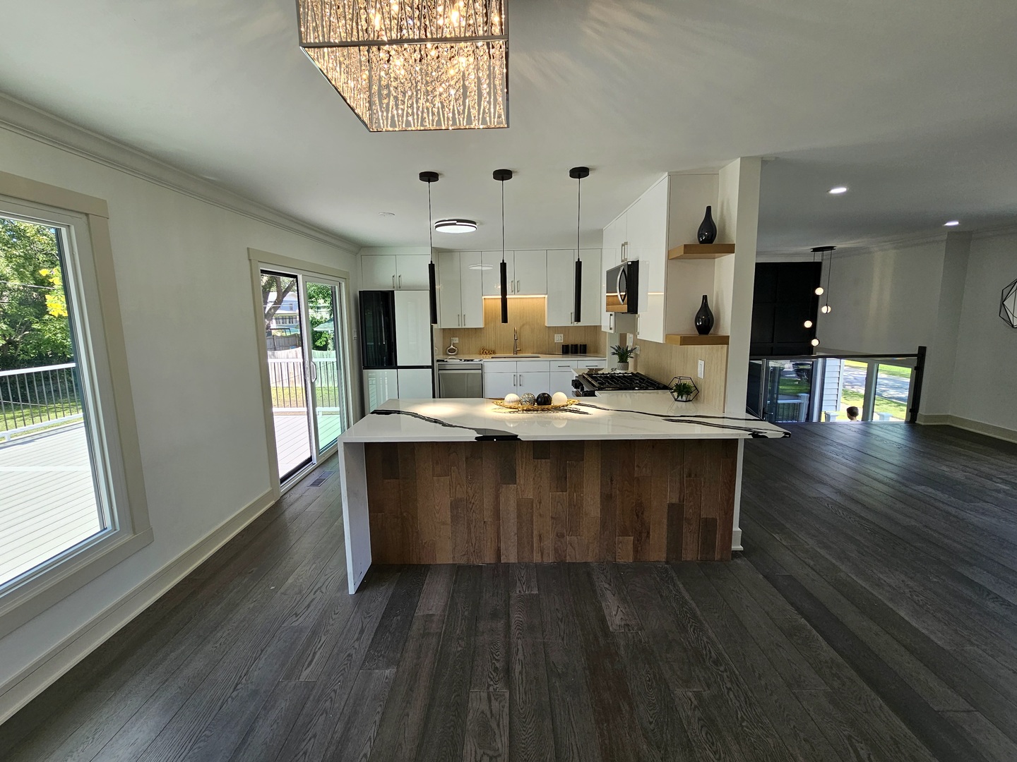 6230 Boca Rio Drive Oak Forest, IL 60452 - Photo 7 of 29 a dining room with wooden floor a chandelier a glass table and chairs