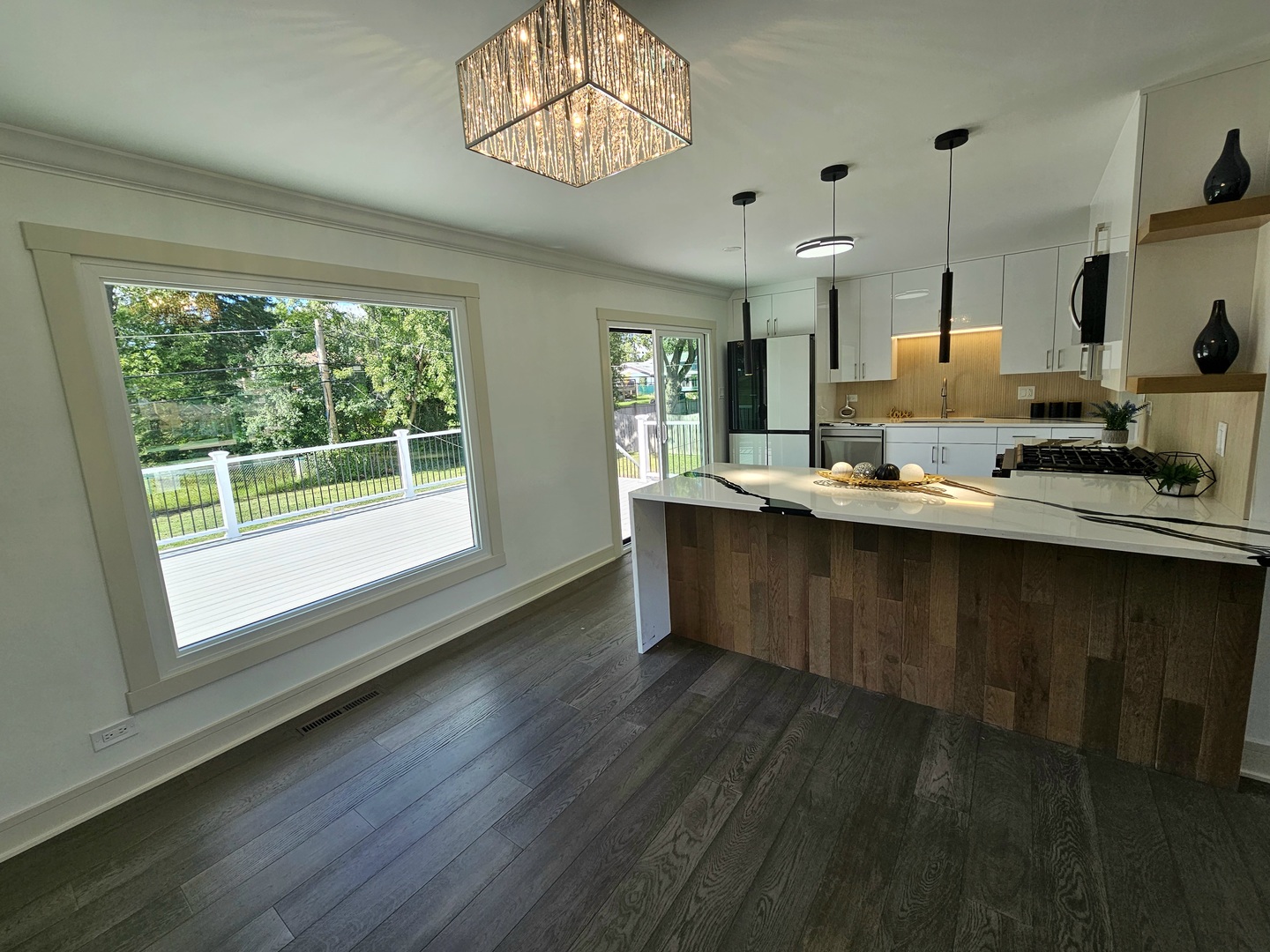 6230 Boca Rio Drive Oak Forest, IL 60452 - Photo 8 of 29 a kitchen with kitchen island granite countertop a sink cabinets and wooden floor
