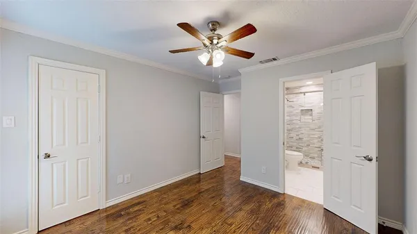 wooden floor in a hall with a window