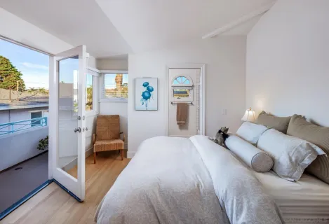 a bed room with a bed and a chair