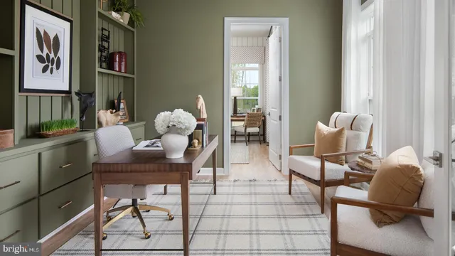 a living room with furniture a large window and wooden floor