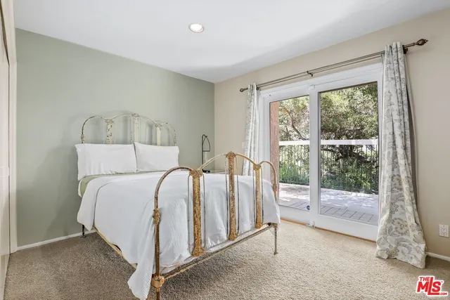 a view of a house with backyard porch and sitting area
