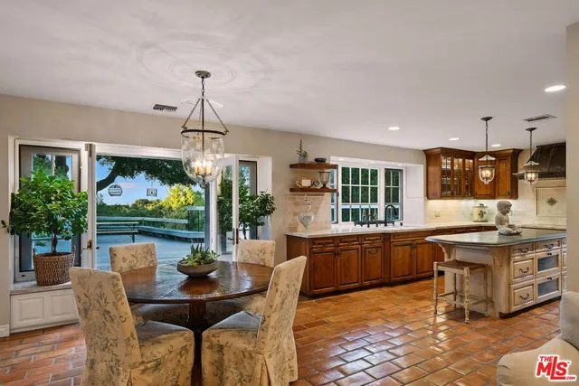 a kitchen with a sink stove and wooden cabinets