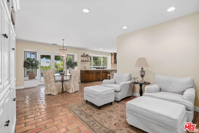 a living room with fireplace furniture and a wooden floor