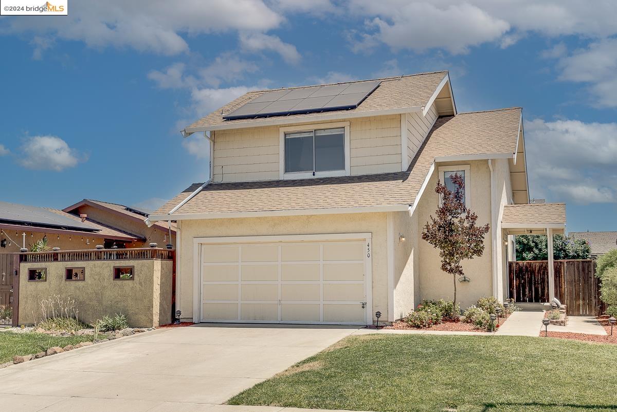 450 Almondtree Circle Oakley, CA 94561 - Photo 1 of 1 a front view of a house with garden