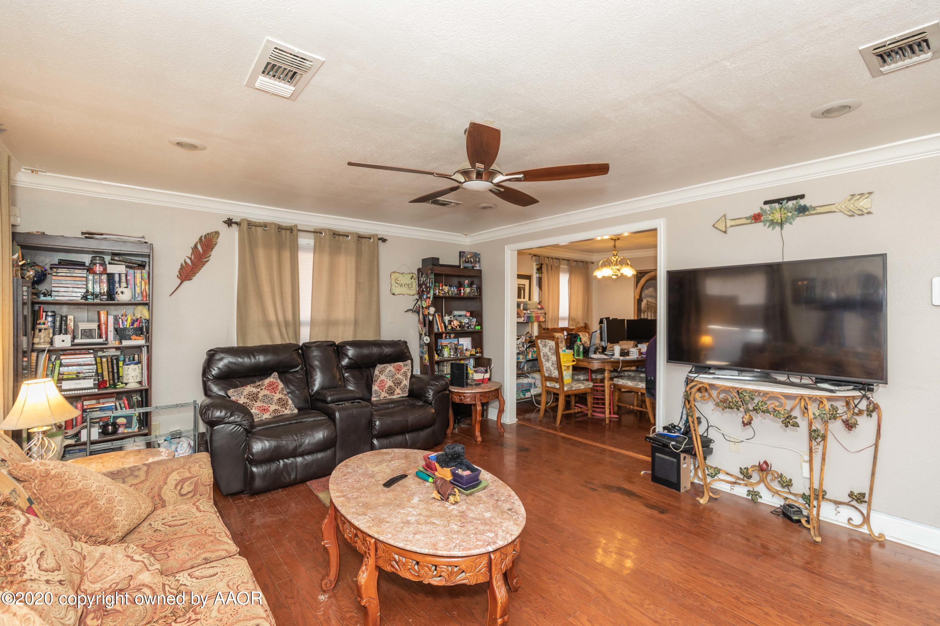 3505 South Tyler Street Amarillo, TX 79110 - Photo 5 of 29 a living room with furniture and a flat screen tv