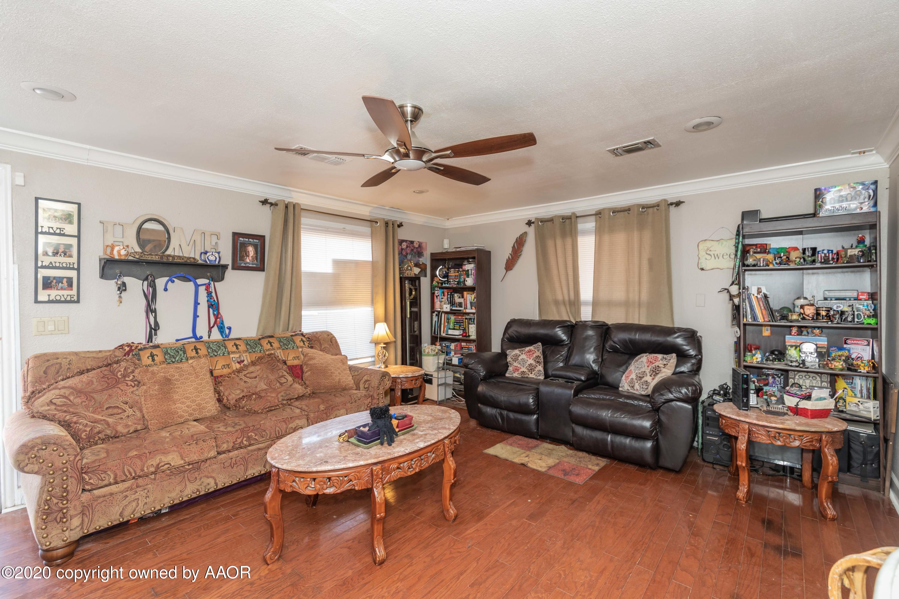 3505 South Tyler Street Amarillo, TX 79110 - Photo 7 of 29 a living room with furniture and a wooden floor