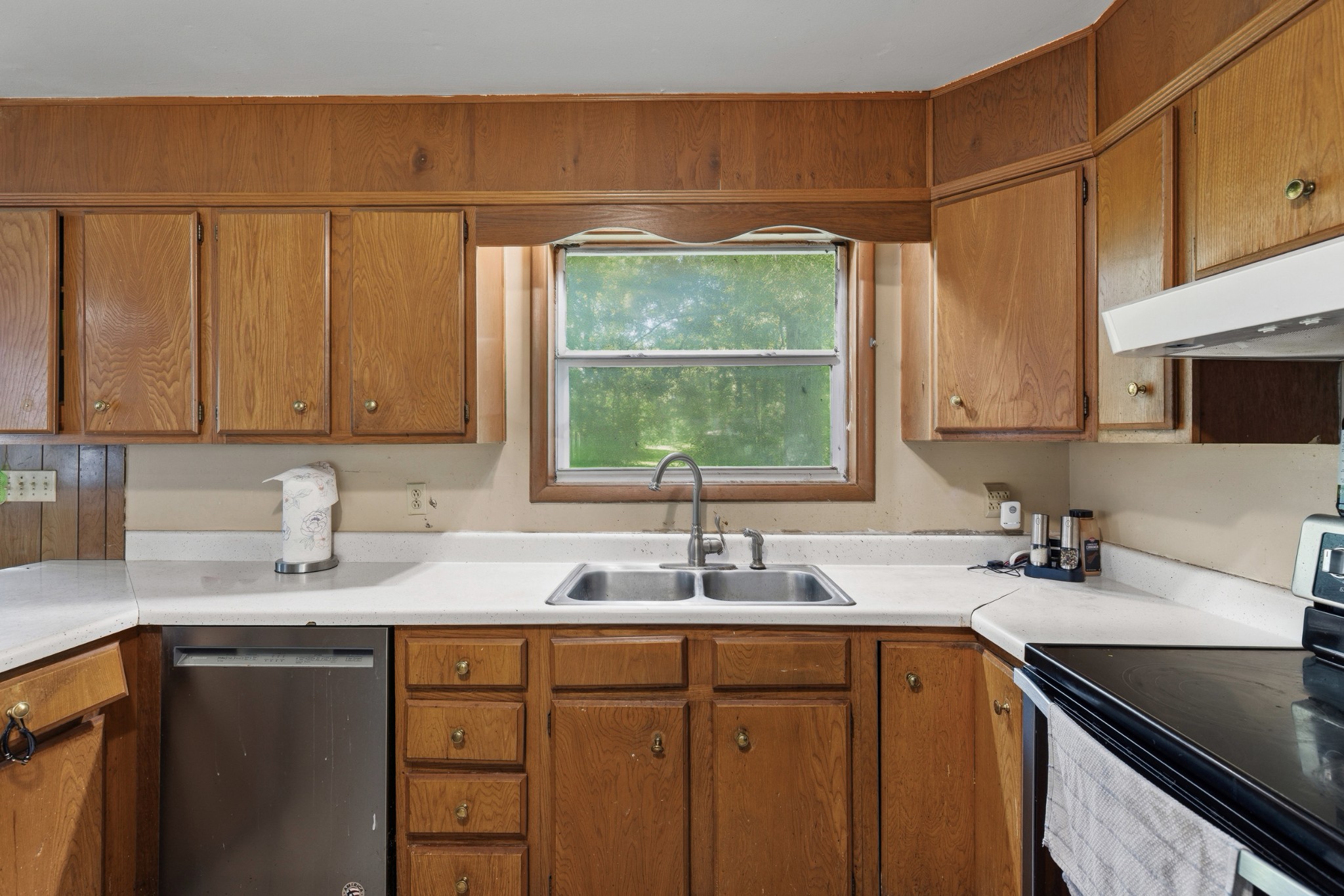 2262 Pleasant View Road Pleasant View, TN 37146 - Photo 5 of 25 a kitchen with stainless steel appliances a sink a stove cabinets and a window