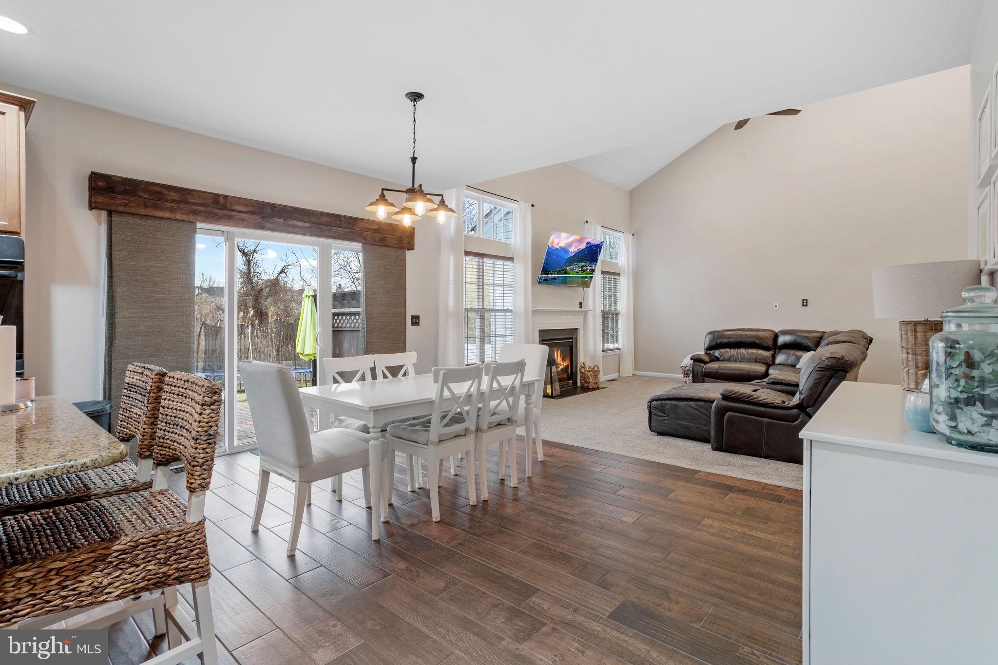 233 Windsor Drive Swedesboro, NJ 08085 - Photo 14 of 46 a living room with furniture and a chandelier