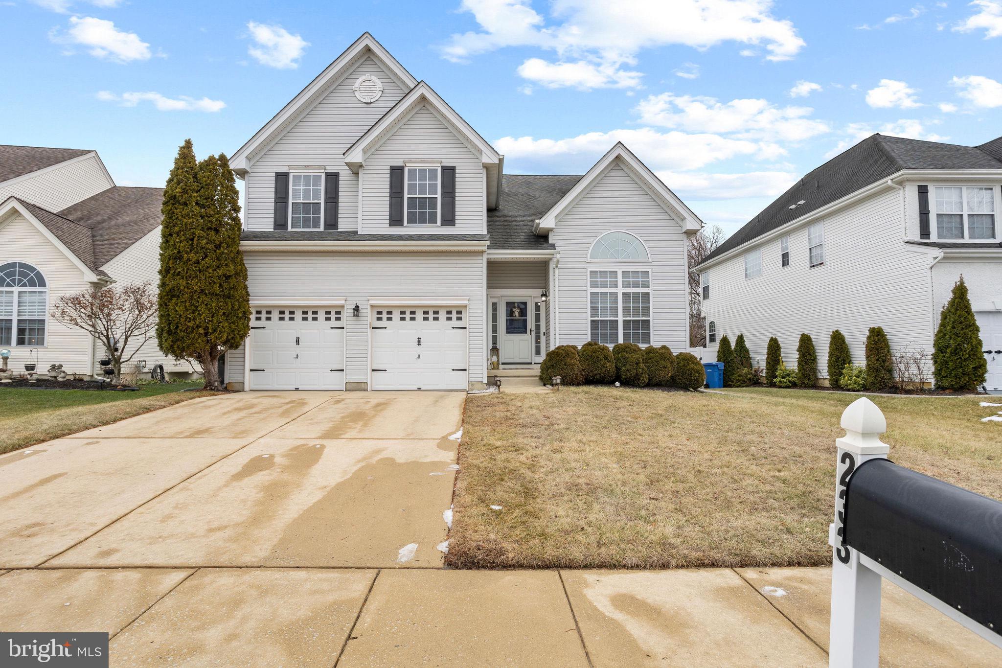 233 Windsor Drive Swedesboro, NJ 08085 - Photo 2 of 46 a front view of a house with a yard