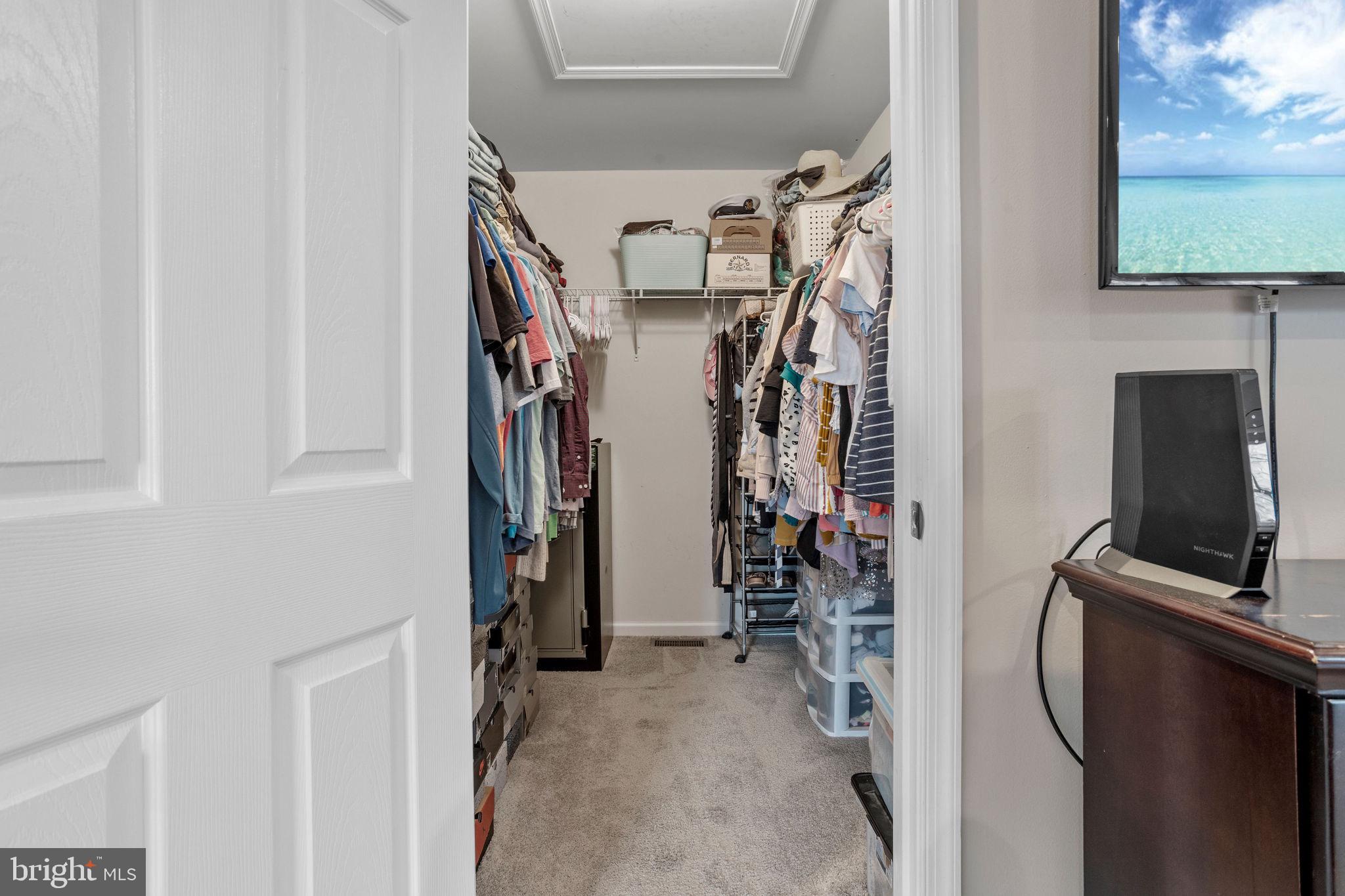 233 Windsor Drive Swedesboro, NJ 08085 - Photo 25 of 46 a view of walk in closet with clothes