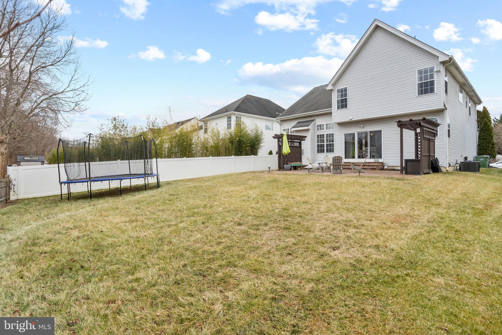 233 Windsor Drive Swedesboro, NJ 08085 - Photo 41 of 46 a view of a house with a yard and sitting area