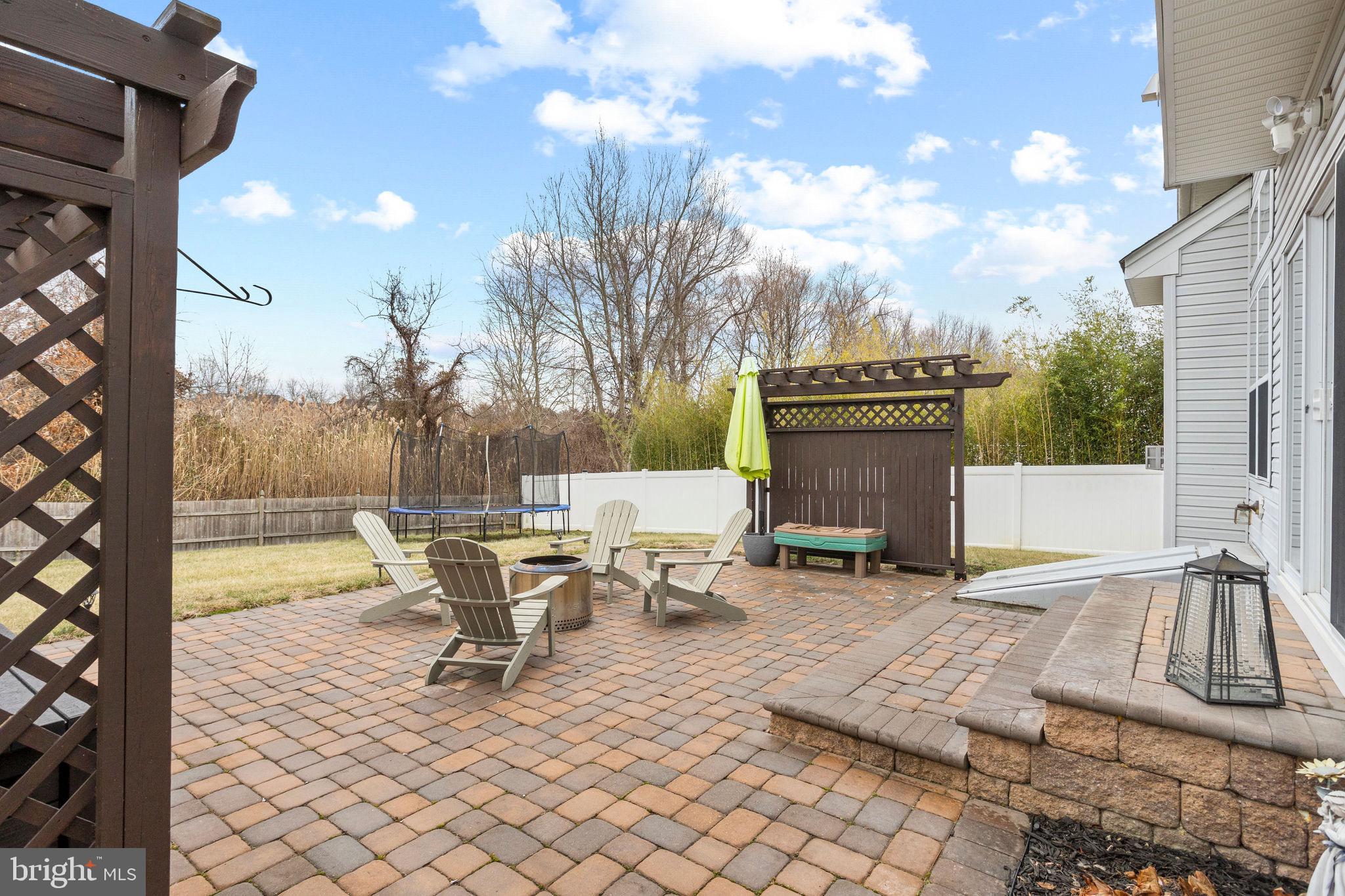 233 Windsor Drive Swedesboro, NJ 08085 - Photo 45 of 46 a view of a patio with a table and chairs