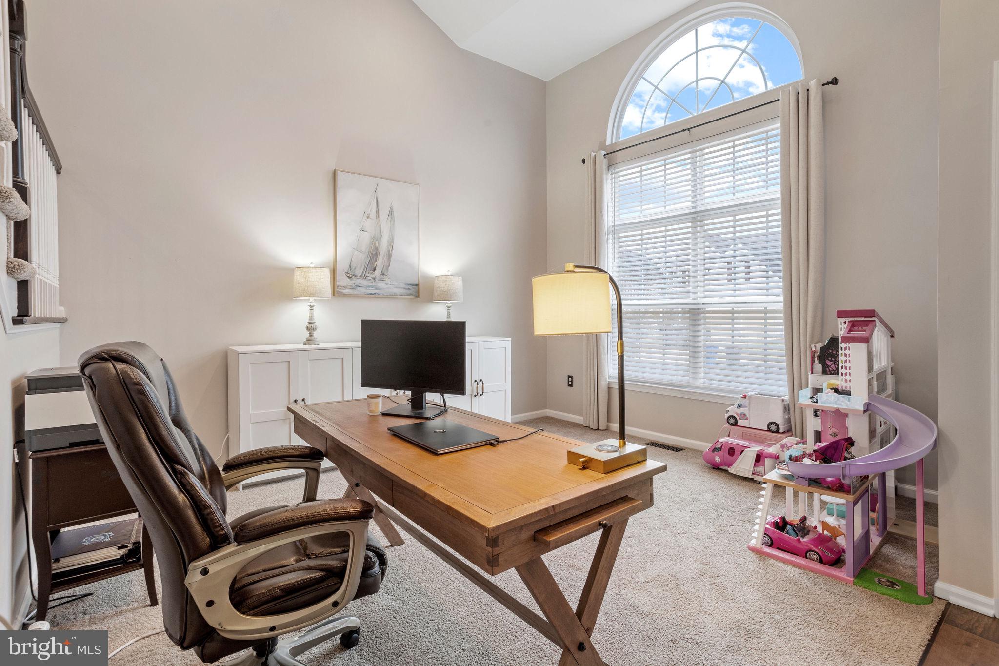 233 Windsor Drive Swedesboro, NJ 08085 - Photo 5 of 46 a view of a workspace with furniture and a window