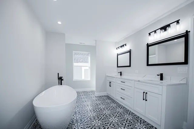 a bathroom with a toilet sink and mirror