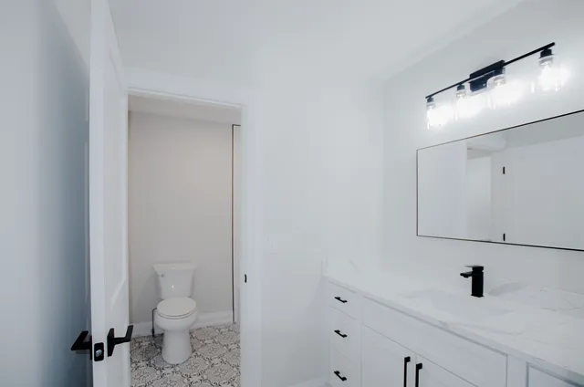 a bathroom with a toilet and a sink