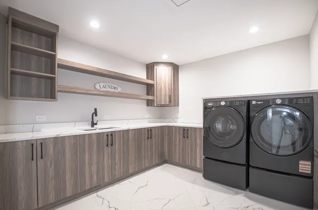 a kitchen with a sink and cabinets