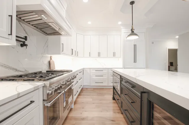 a kitchen with stainless steel appliances granite countertop a stove and a sink