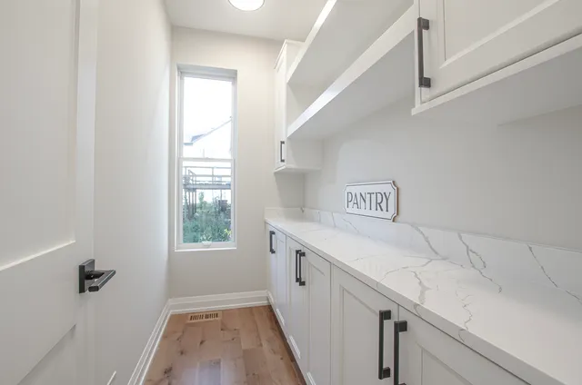 a view of a kitchen with a sink and dishwasher