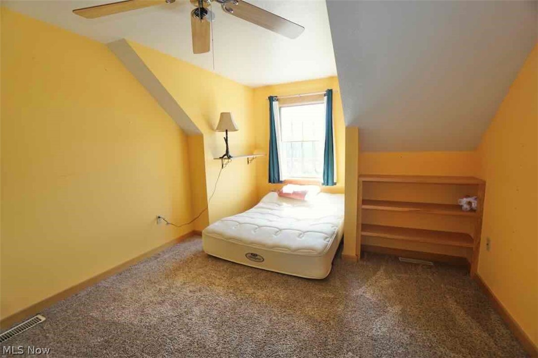 9835 Kile Road Chardon, OH 44024 - Photo 19 of 40 2nd fl. bedroom with carpet, ceiling fan, and lofted ceiling