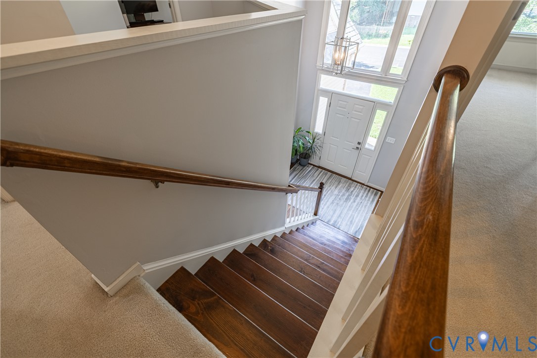 4501 Foxwood Road Chester, VA 23831 - Photo 19 of 42 Two-story foyer featuring a white paneled entry do