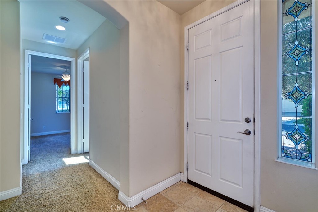 1143 Saguara Road Beaumont, CA 92223 - Photo 45 of 66 an empty room with window and hallway