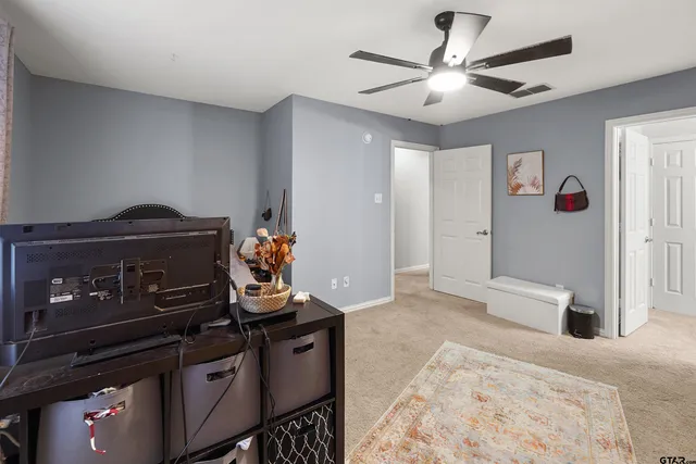 a bedroom with furniture and natural light