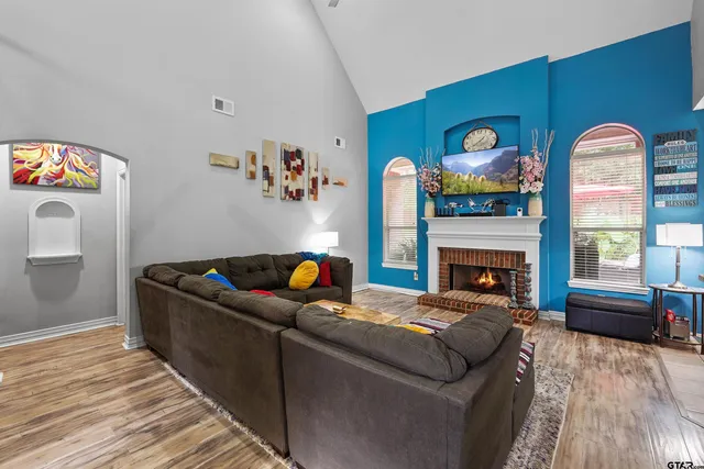 a living room with furniture and a fireplace