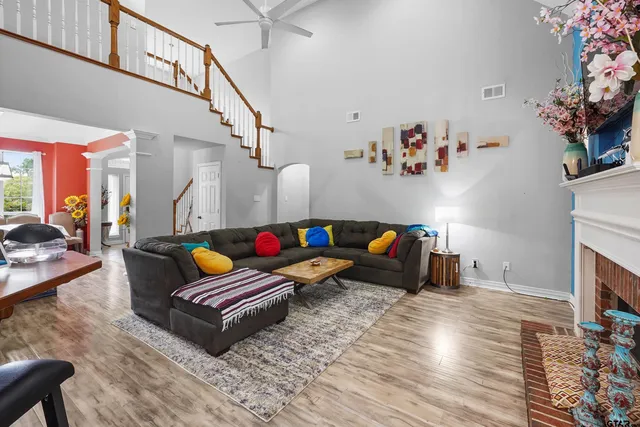 a living room with furniture and a fireplace