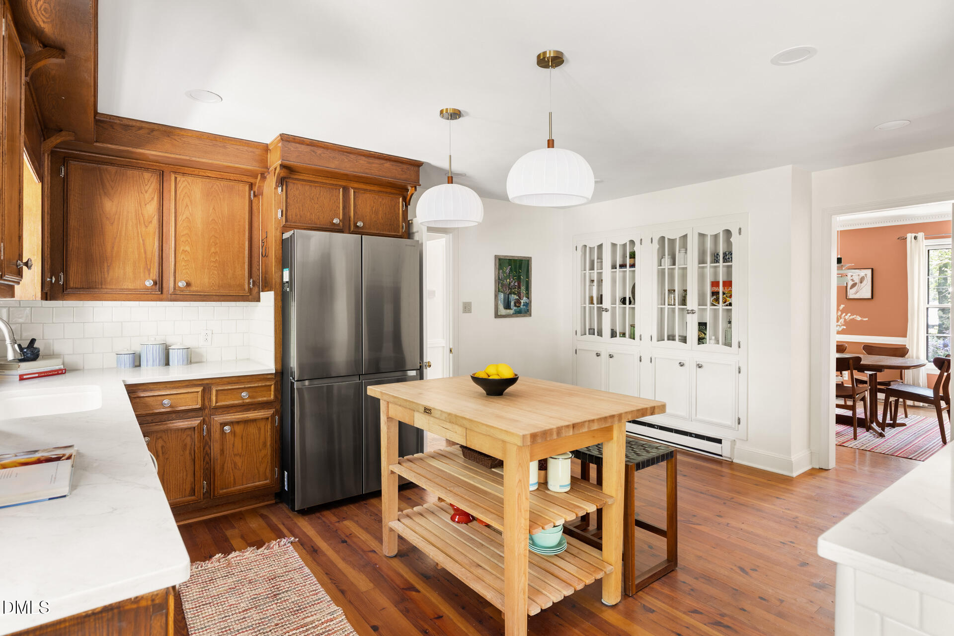 1706 Wallace Street Durham, NC 27707 - Photo 21 of 55 a kitchen with stainless steel appliances a stove a refrigerator and a refrigerator