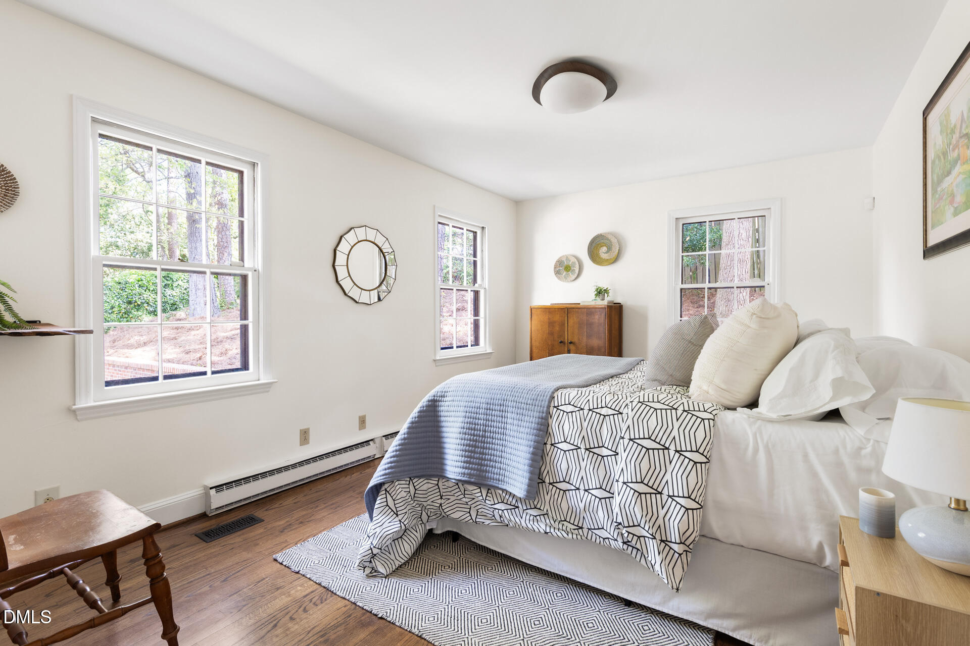 1706 Wallace Street Durham, NC 27707 - Photo 28 of 55 a bedroom with a bed and wooden floor