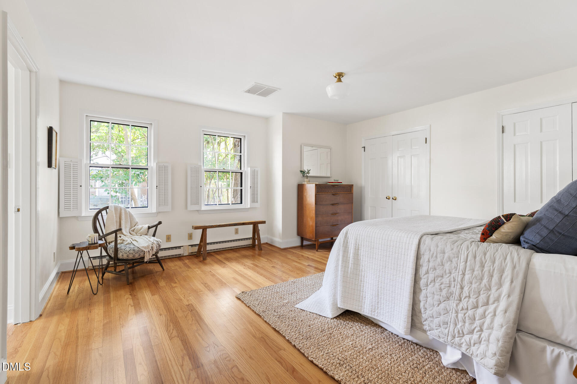 1706 Wallace Street Durham, NC 27707 - Photo 32 of 55 a bed room with a bed and a chair