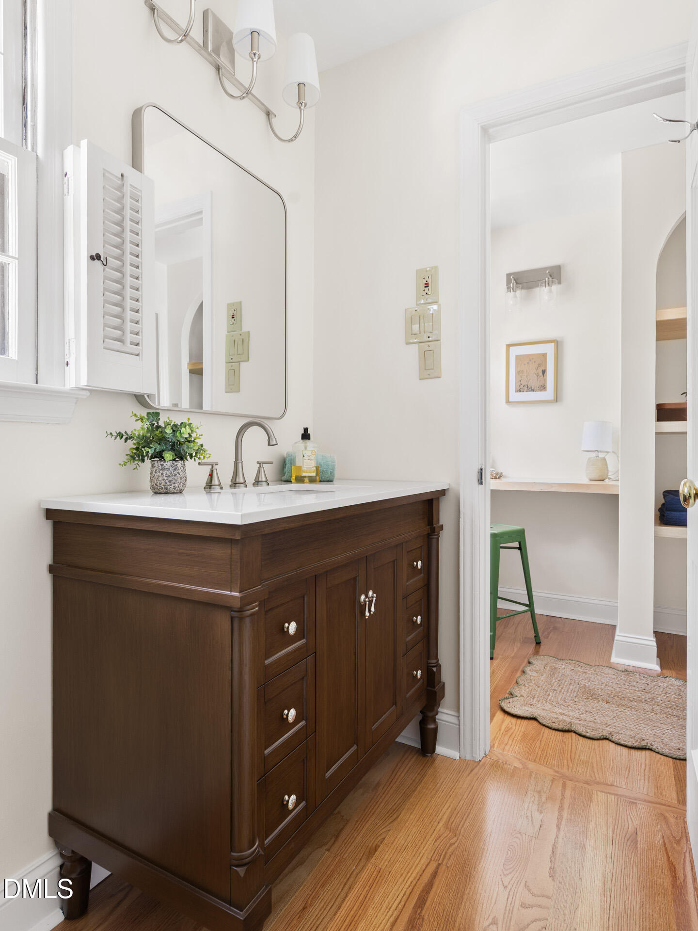 1706 Wallace Street Durham, NC 27707 - Photo 39 of 55 a bathroom with a sink double vanity and a mirror