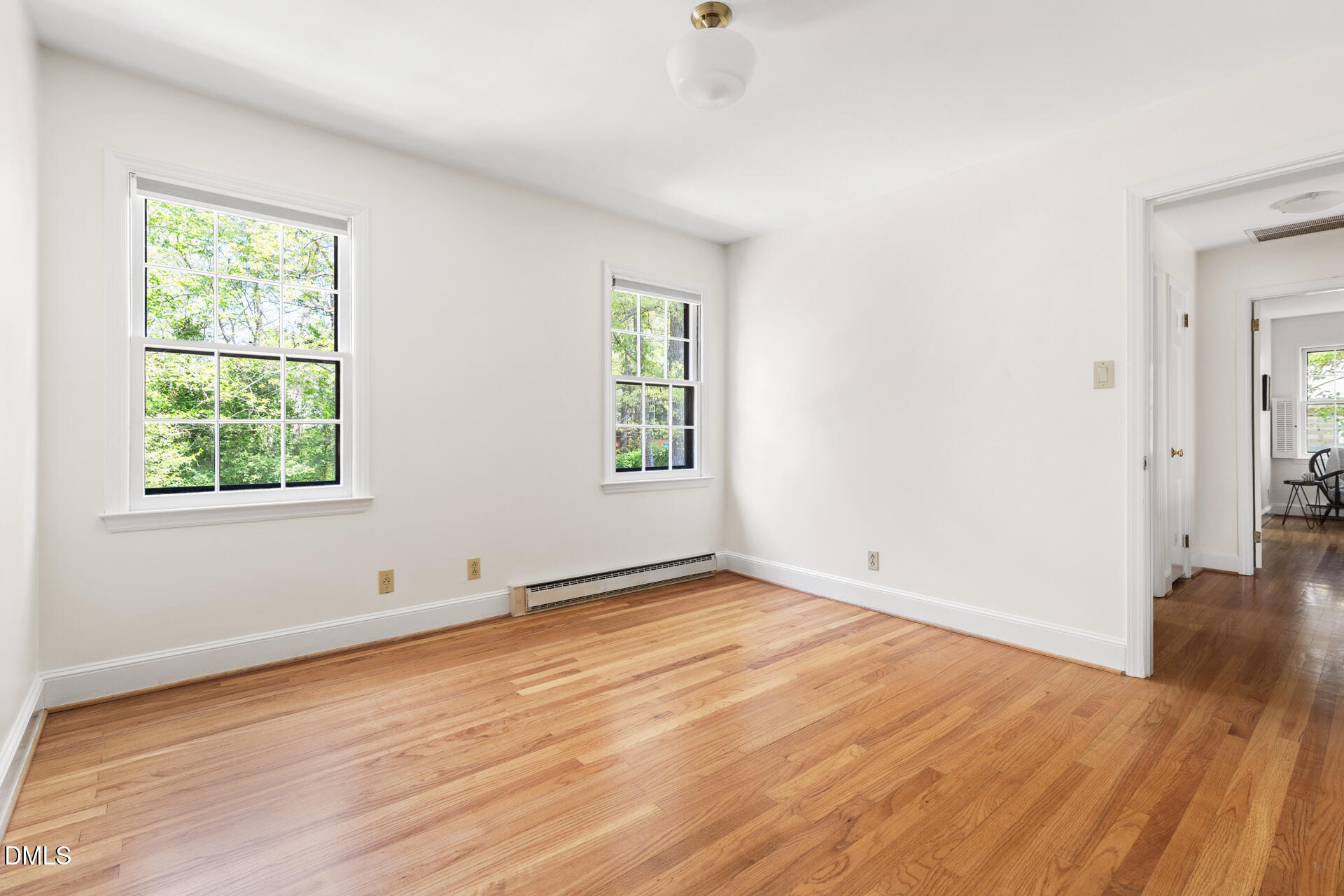 1706 Wallace Street Durham, NC 27707 - Photo 40 of 55 an empty room with wooden floor and windows