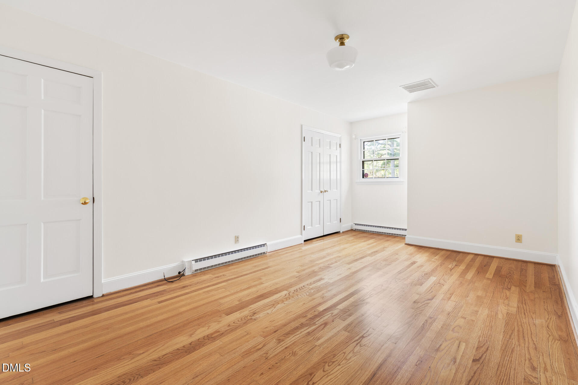 1706 Wallace Street Durham, NC 27707 - Photo 43 of 55 a view of an empty room with wooden floor