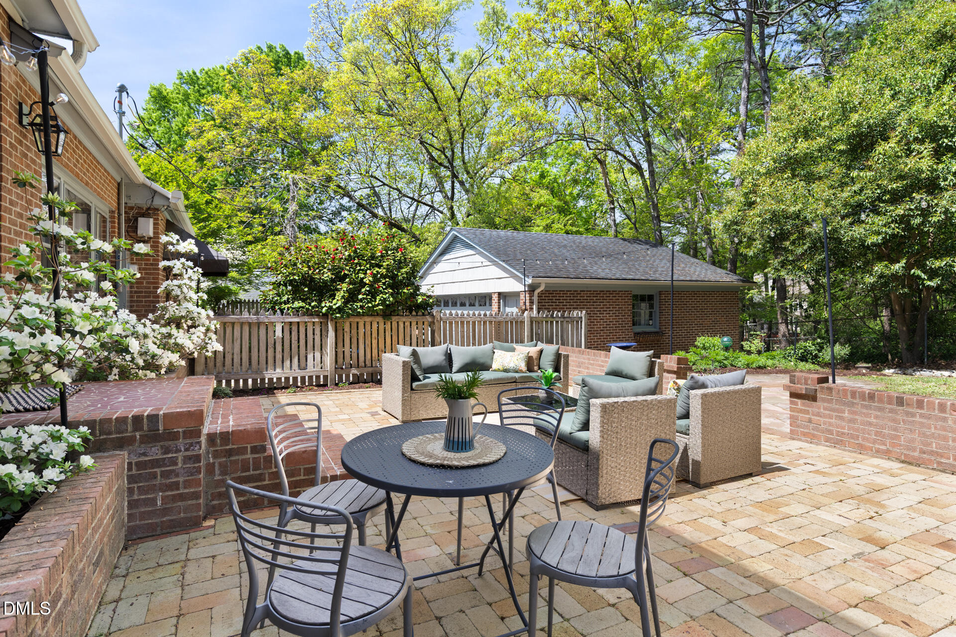 1706 Wallace Street Durham, NC 27707 - Photo 44 of 55 a patio with a table and chairs and potted plants