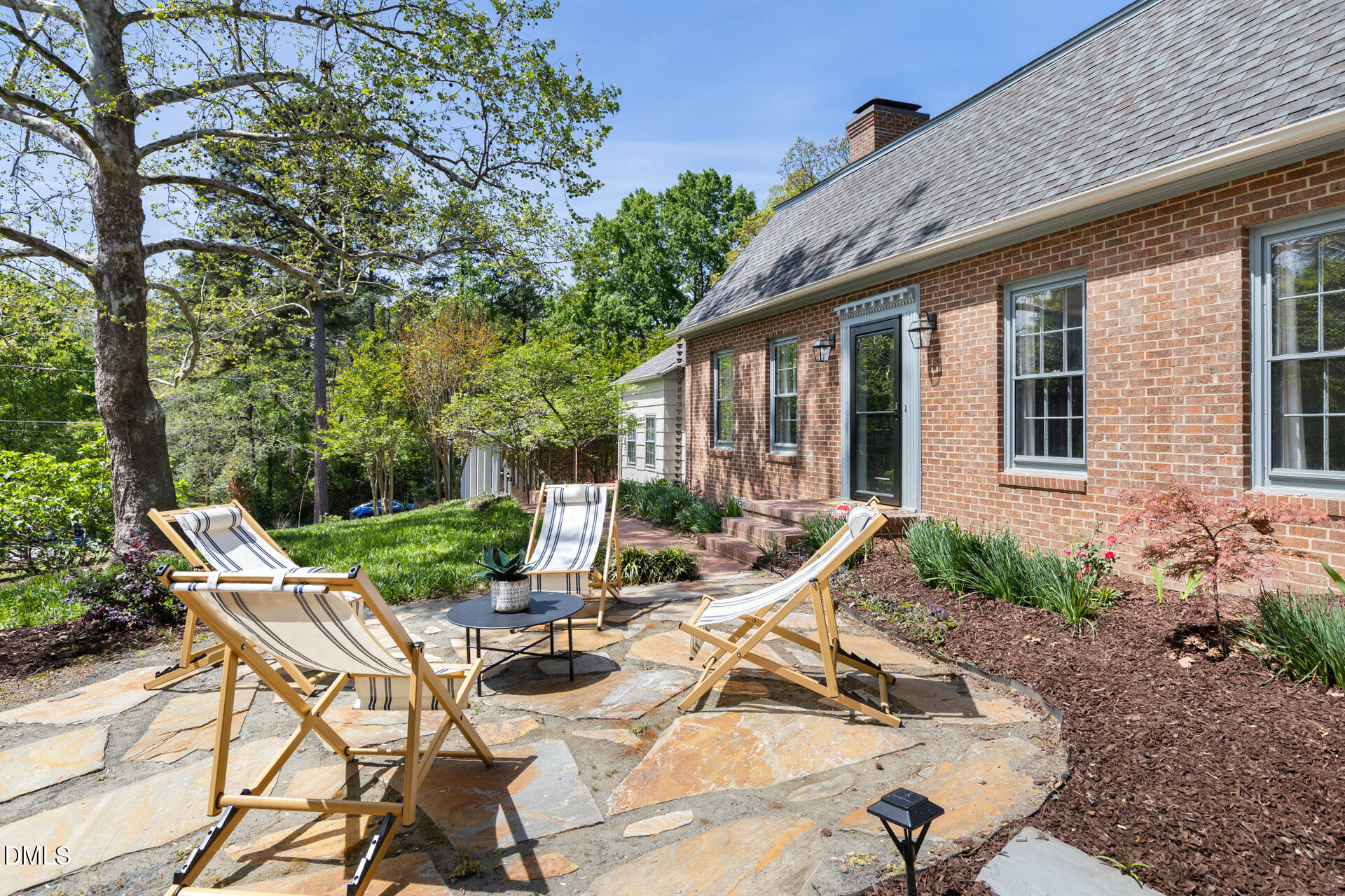 1706 Wallace Street Durham, NC 27707 - Photo 48 of 55 a view of backyard with outdoor seating and plants
