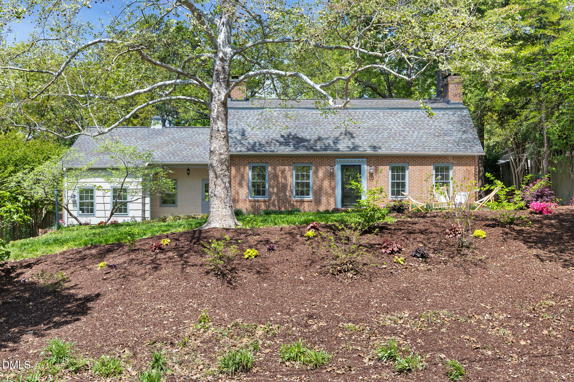 1706 Wallace Street Durham, NC 27707 - Photo 52 of 55 a front view of a house with a garden