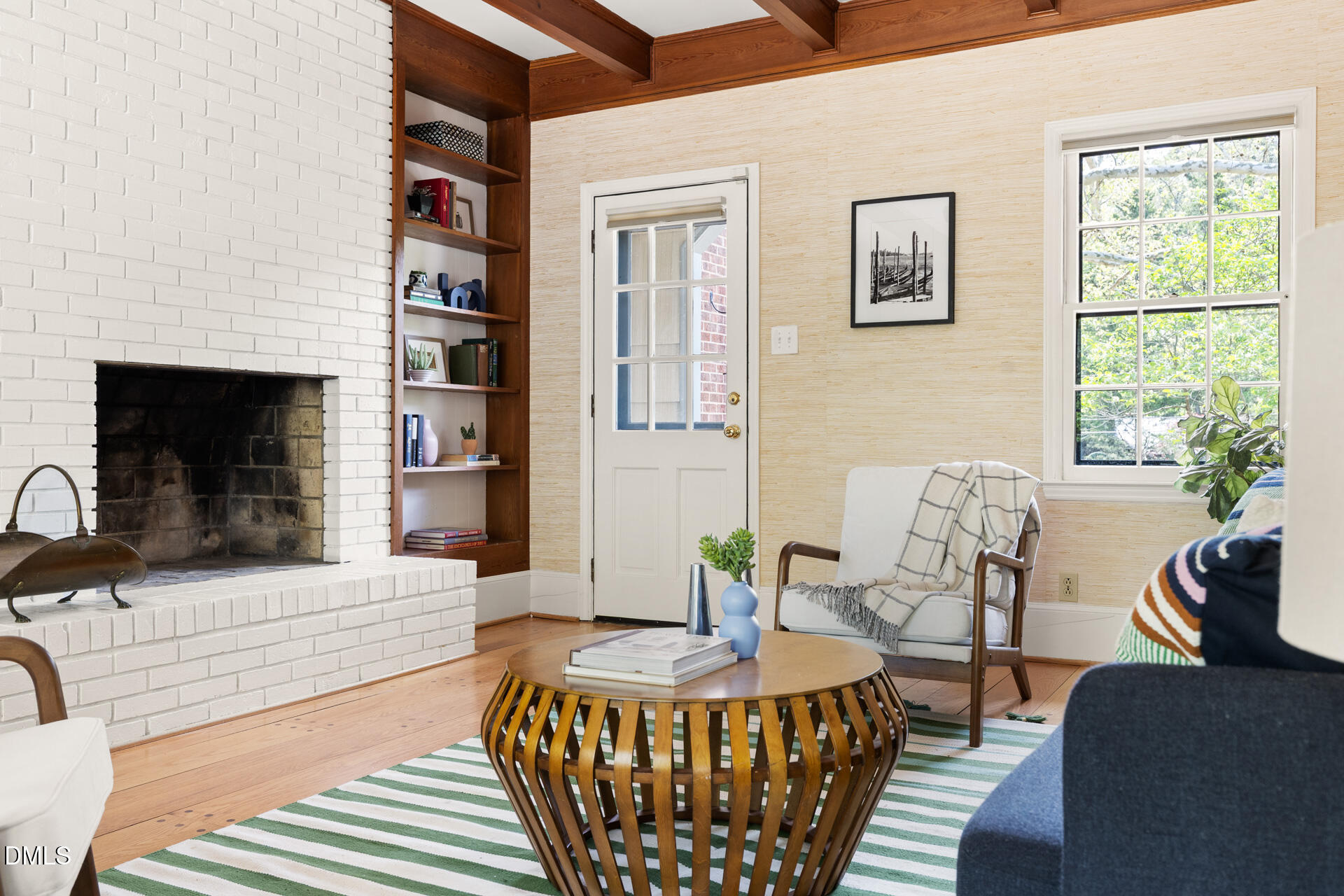 1706 Wallace Street Durham, NC 27707 - Photo 5 of 55 a living room with furniture a fireplace and a table