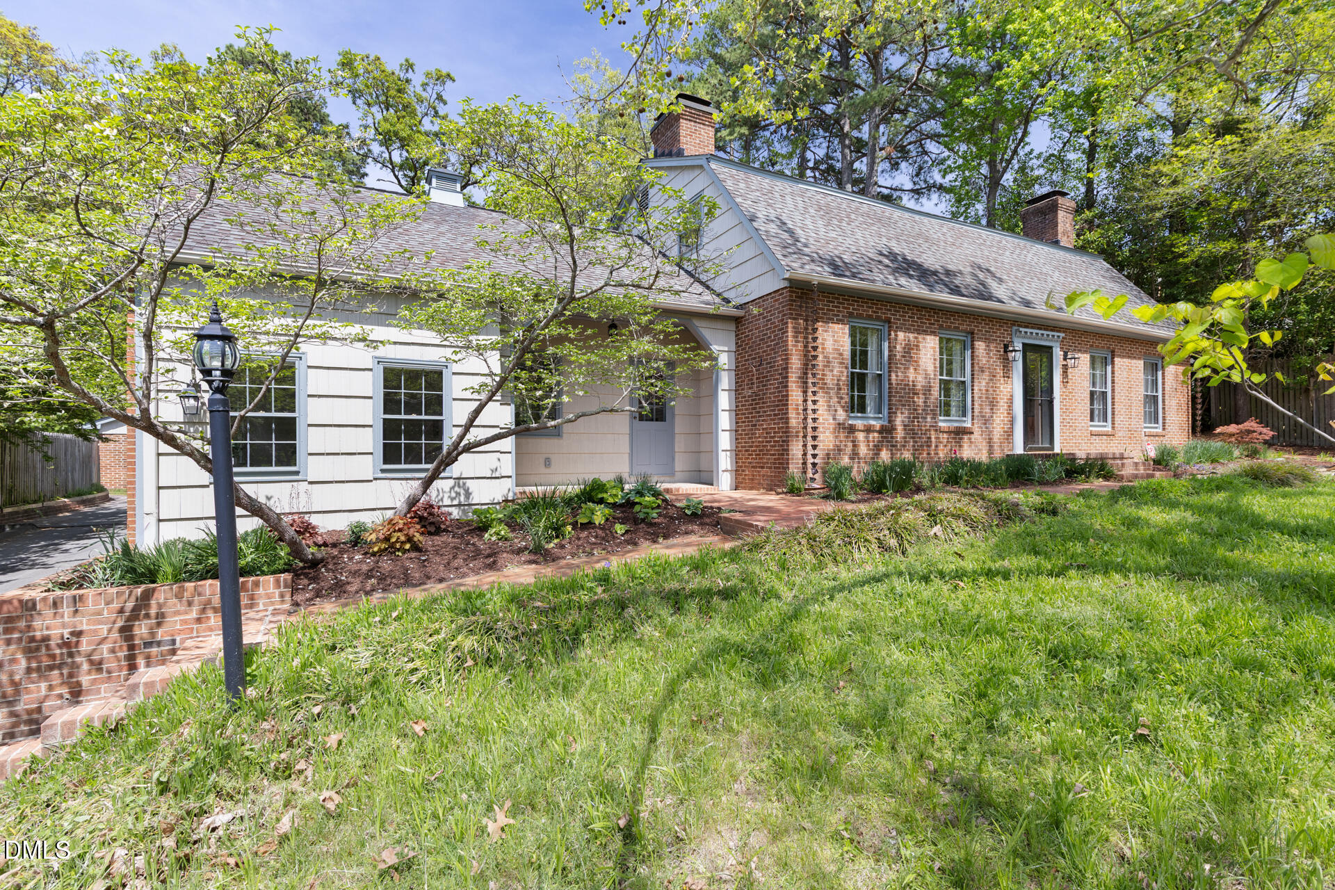 1706 Wallace Street Durham, NC 27707 - Photo 6 of 55 a front view of a house with a yard and potted plants