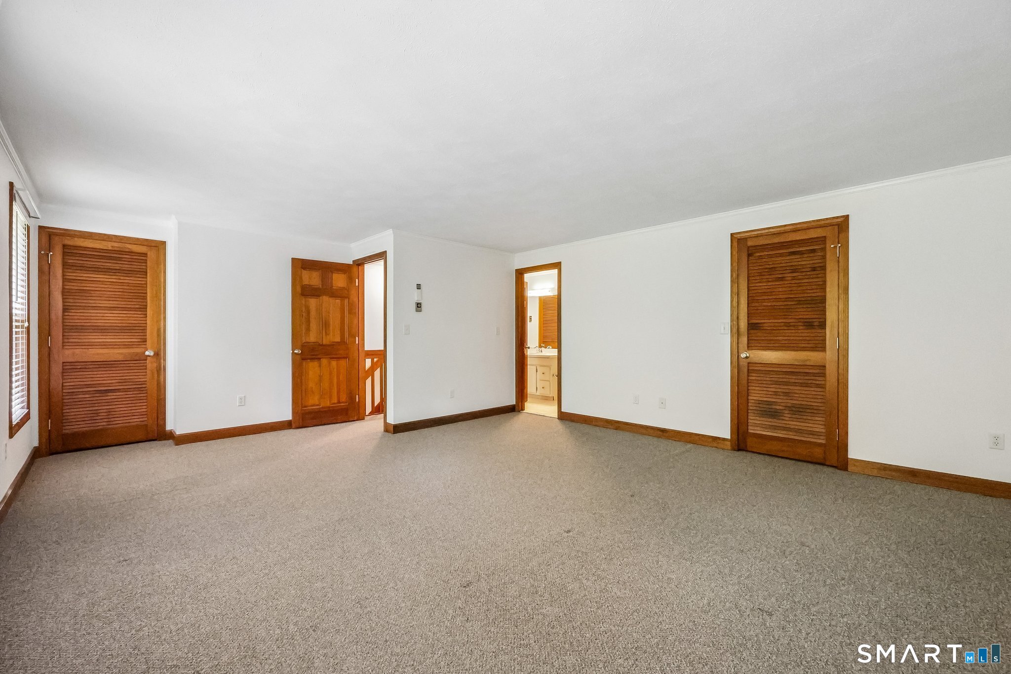 65 Old Route 79, Unit 5 Madison, CT 06443 - Photo 18 of 28 A huge walk-in closet plus a second closet are great features in the primary bedroom