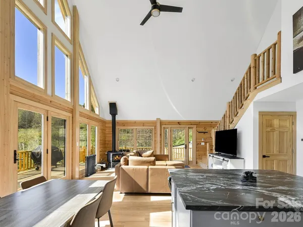 a living room with large furniture and a flat screen tv