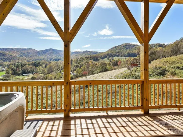 a view of a balcony with wooden floor
