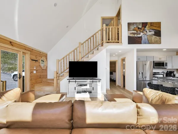 a living room with furniture and a flat screen tv