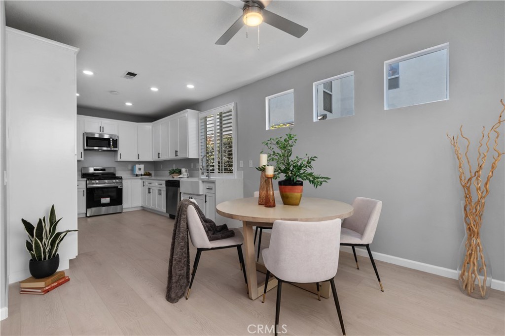 17 Nopalitos Way Aliso Viejo, CA 92656 - Photo 11 of 37 a view of a dining room with furniture and a potted plant